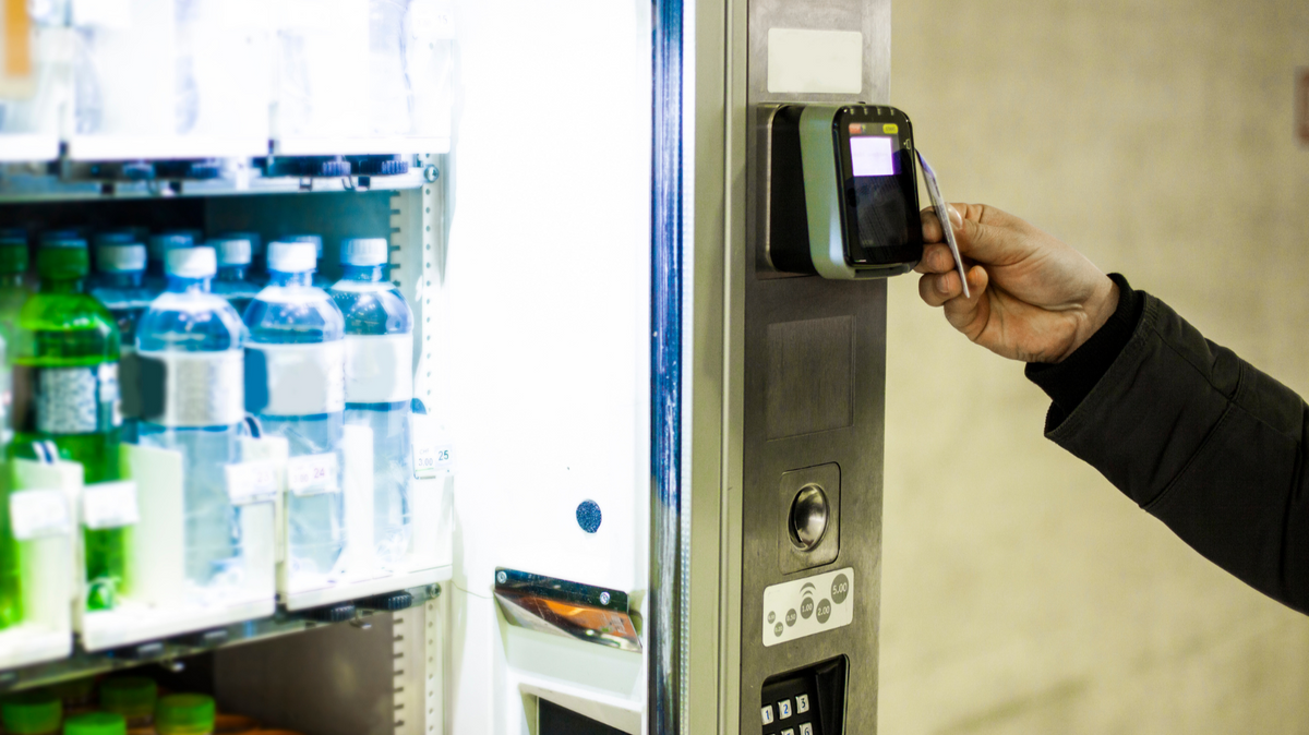 Vending machine customer using card payment reader