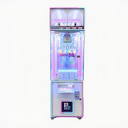 Glowing pink and blue claw machine on a white background